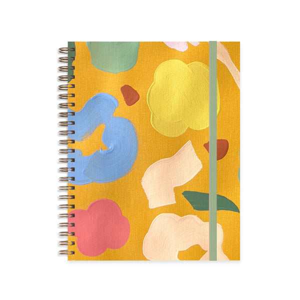 Marigold Medium A5 Notebook by Moglea, featuring a vibrant marigold cover and lined pages inside.